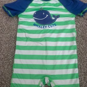 One piece boy swim suit.